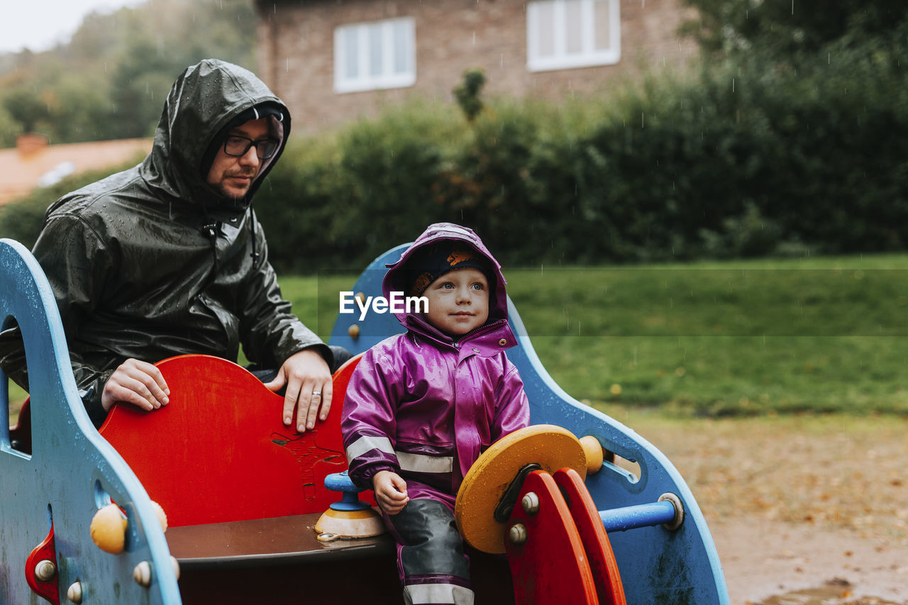 Father with daughter on playground