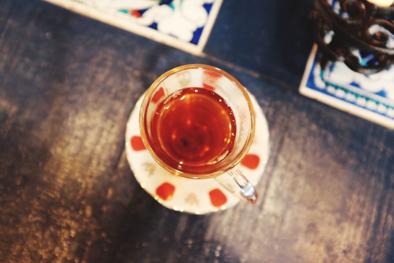 High angle view of black tea in cup on table