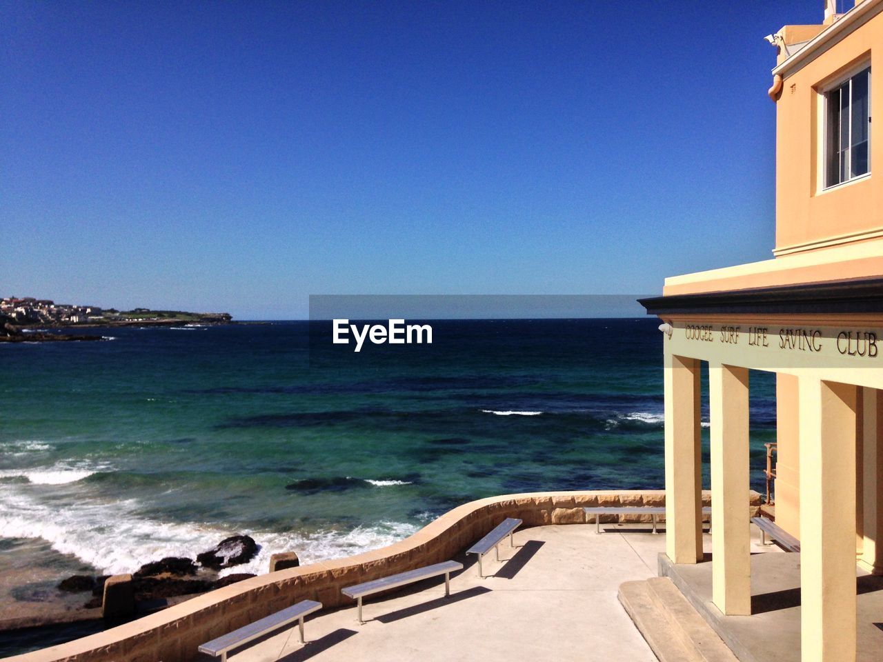 Scenic view of sea against clear blue sky