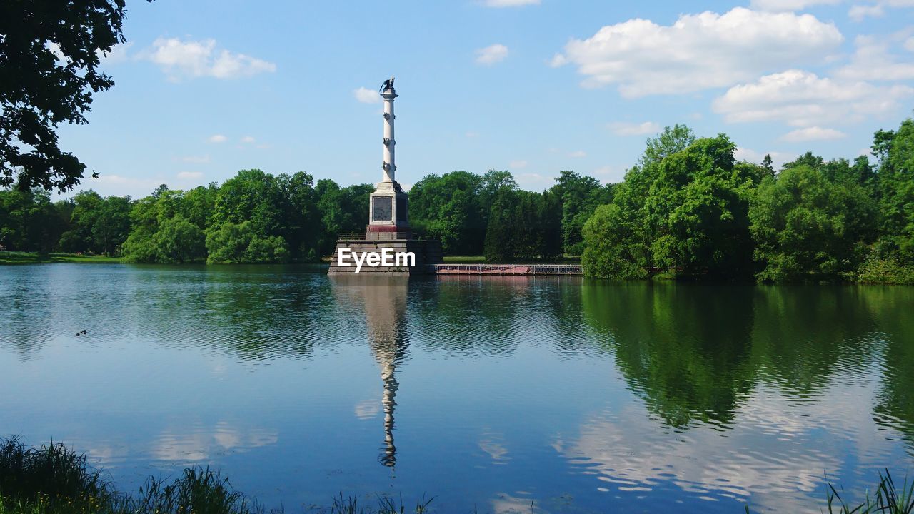 Scenic view of lake against cloudy sky