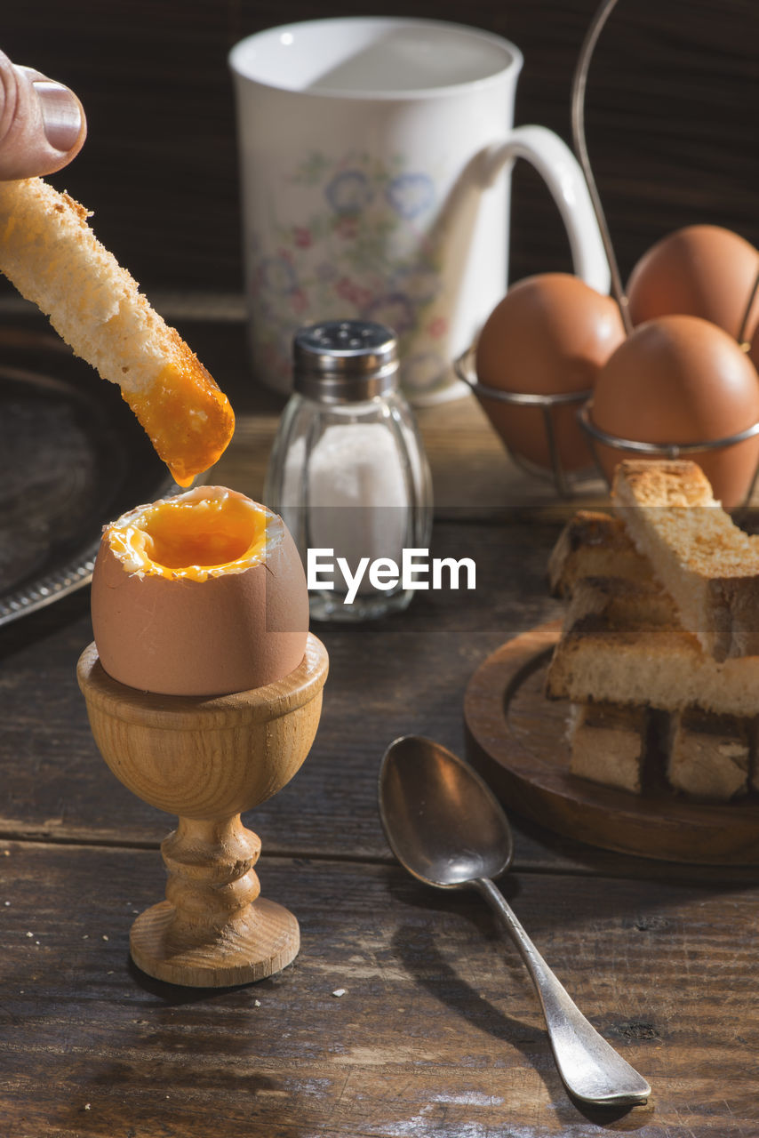 CLOSE-UP OF BREAKFAST SERVED ON TABLE WITH SPOON