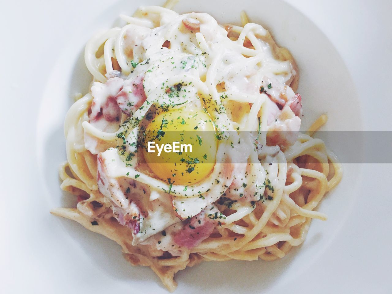 Directly above shot of spaghetti and egg in plate