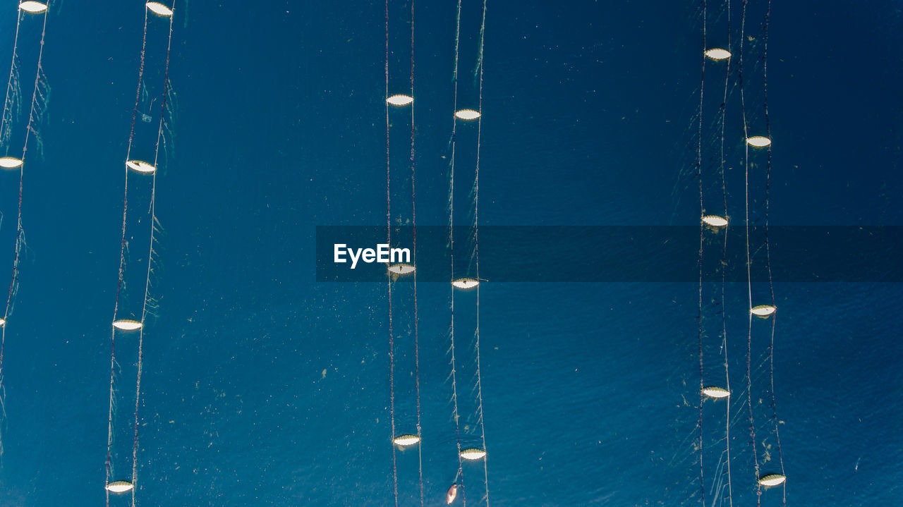 Aerial view of buoys on sea