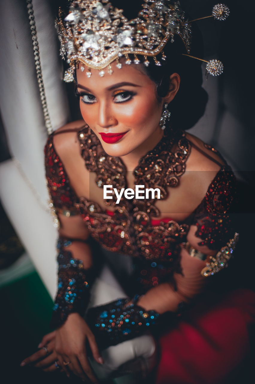 Portrait of young woman in traditional malay wedding dress. 