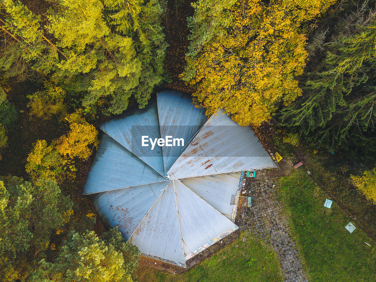 Directly above shot of built structure by trees during autumn