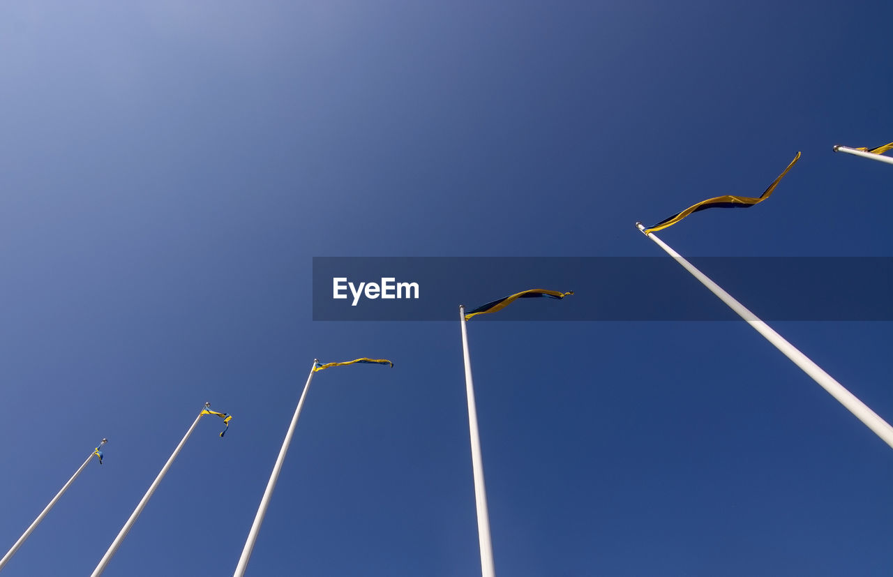 LOW ANGLE VIEW OF BIRD FLYING IN SKY