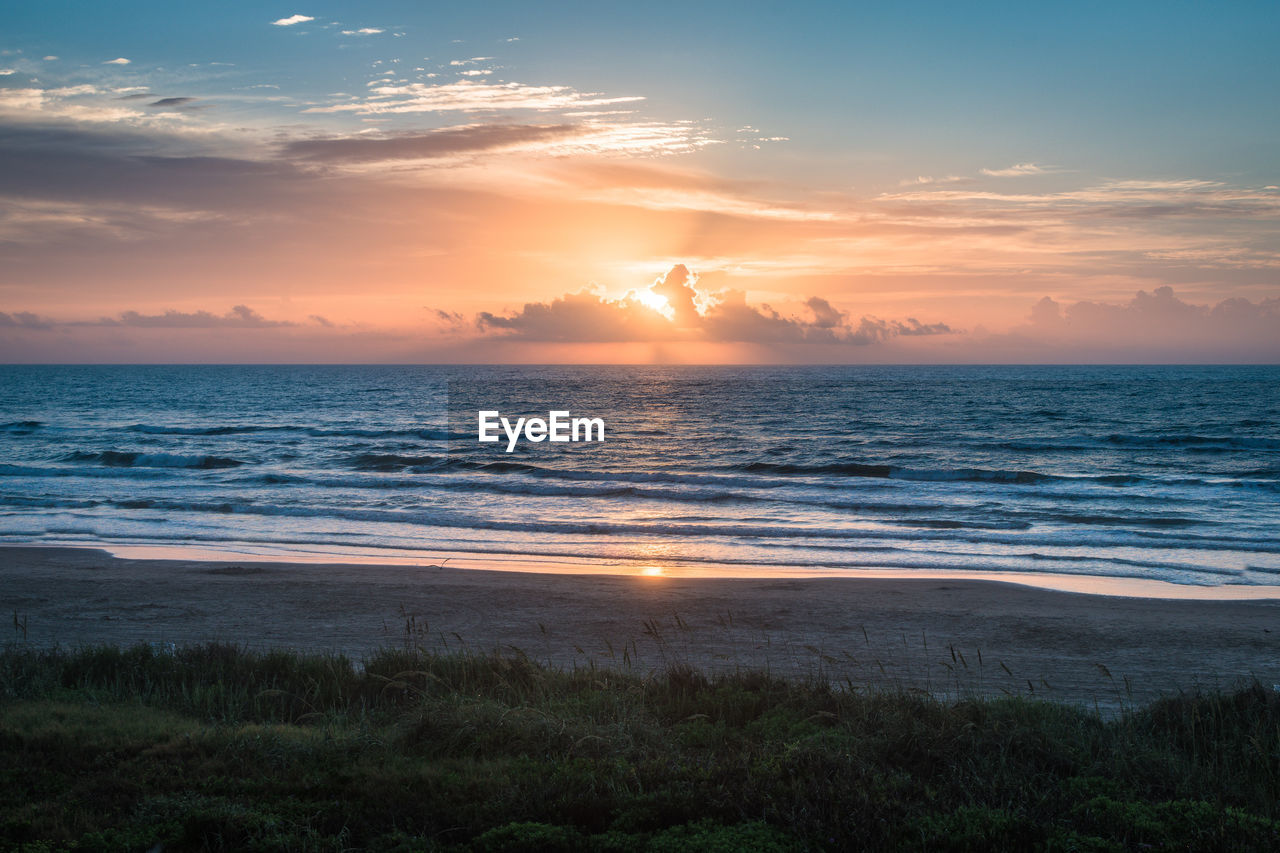 Scenic view of sea against sky during sunset