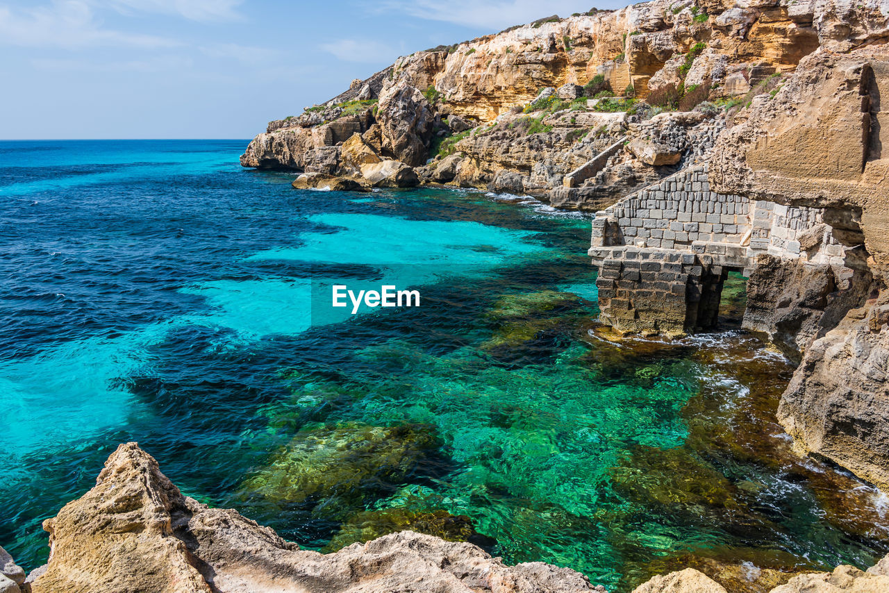 The tropical seewater on the shore of favignana, one of the aegadian islands in sicily