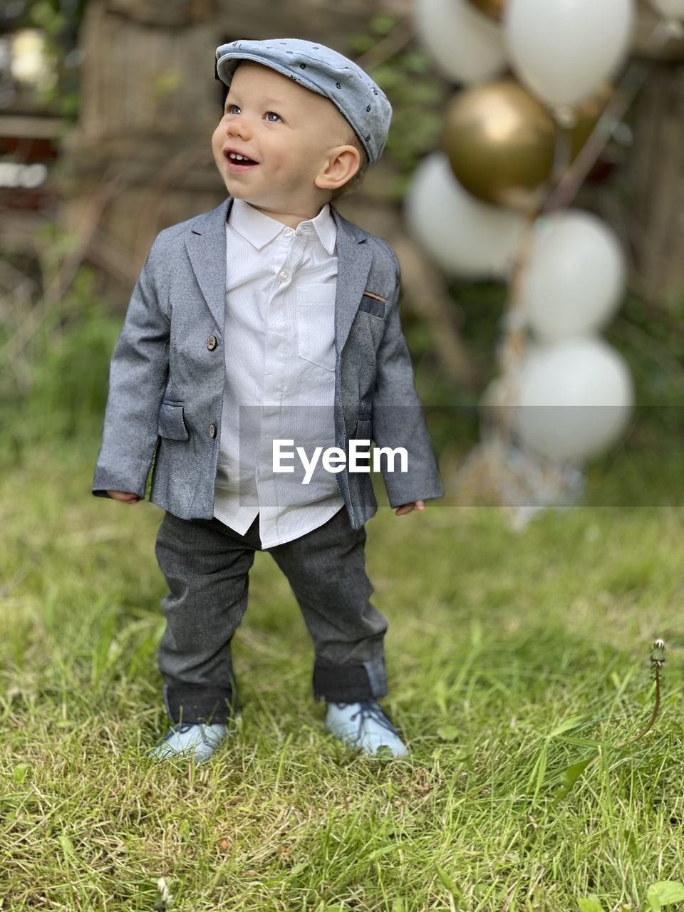 Cute boy looking away on field