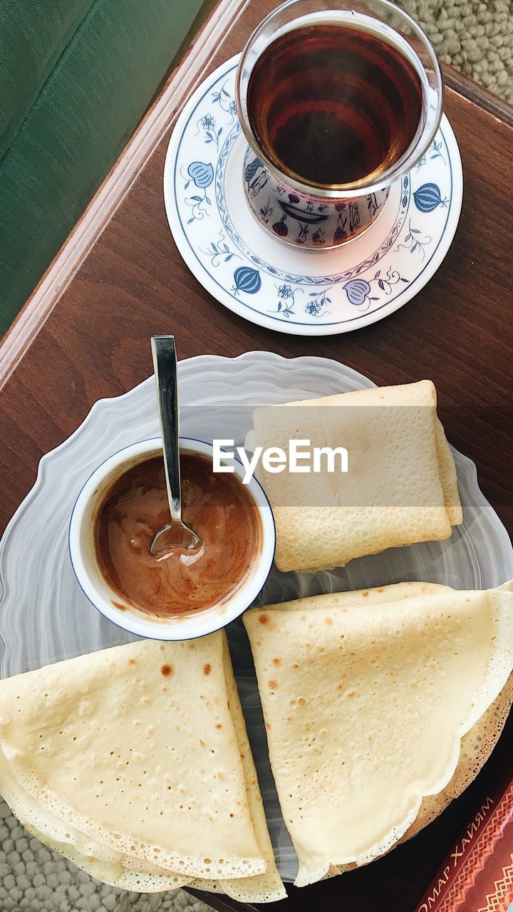 HIGH ANGLE VIEW OF COFFEE CUP AND TEA