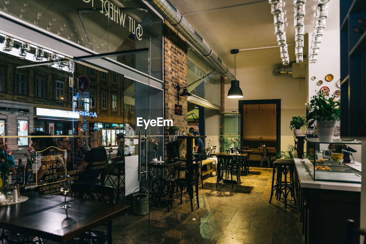 CHAIRS AND TABLES IN CAFE