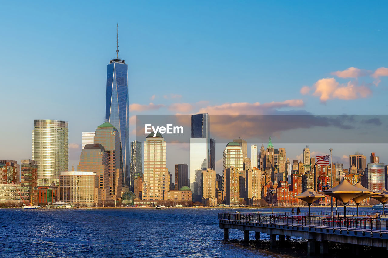 view of buildings in city against sky during sunset