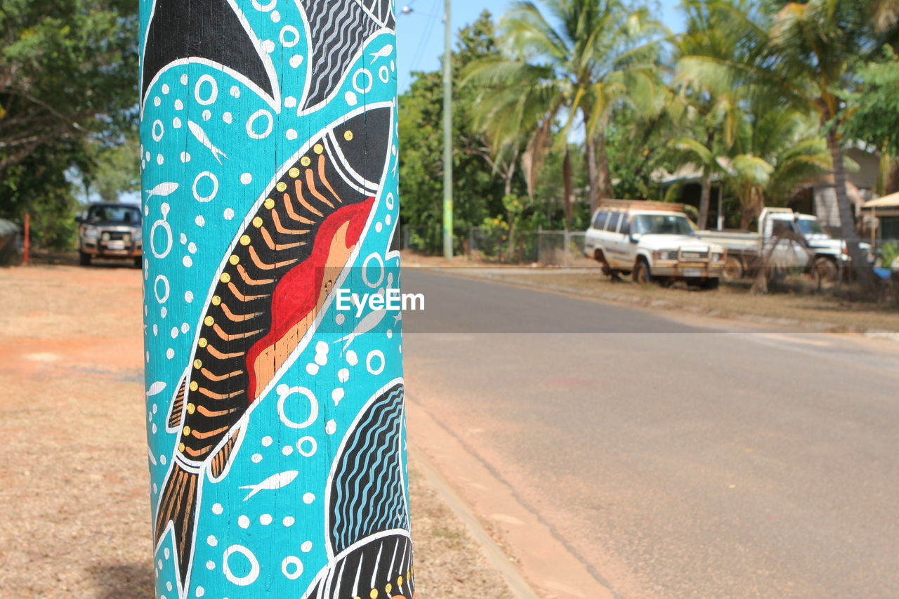 CLOSE-UP OF ROAD AGAINST BLURRED BACKGROUND