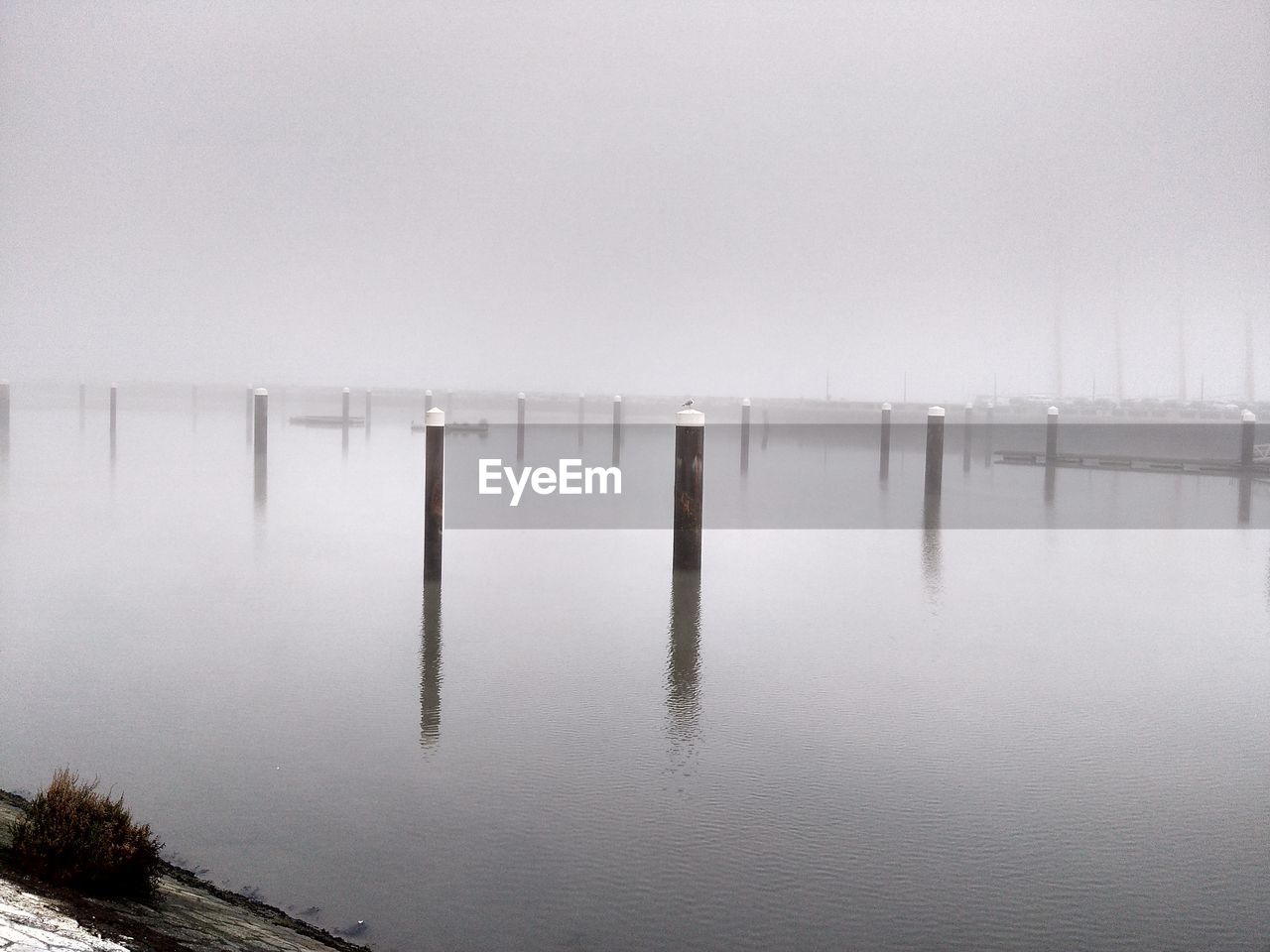 PIER ON LAKE DURING WINTER