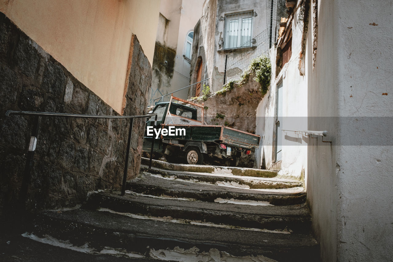 Land vehicle parked amidst buildings in city