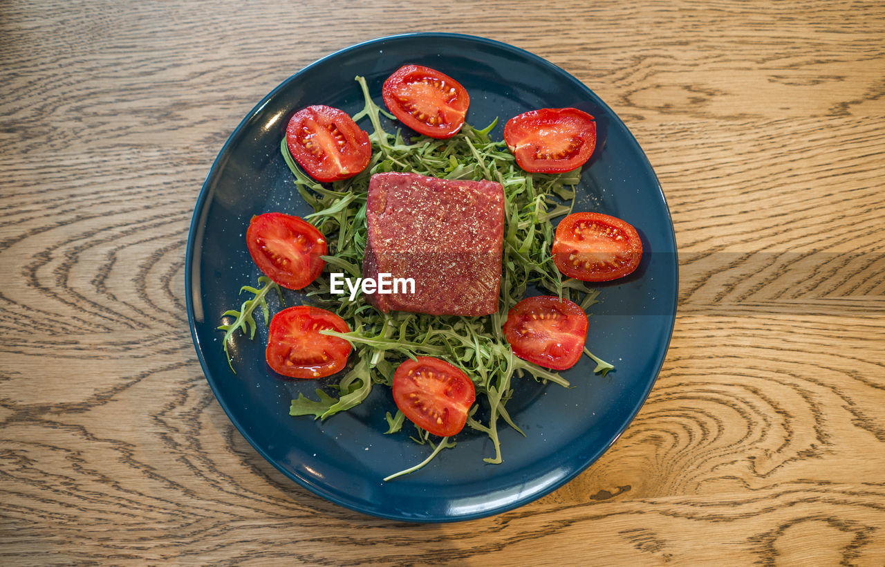 High angle view of salad in bowl on table