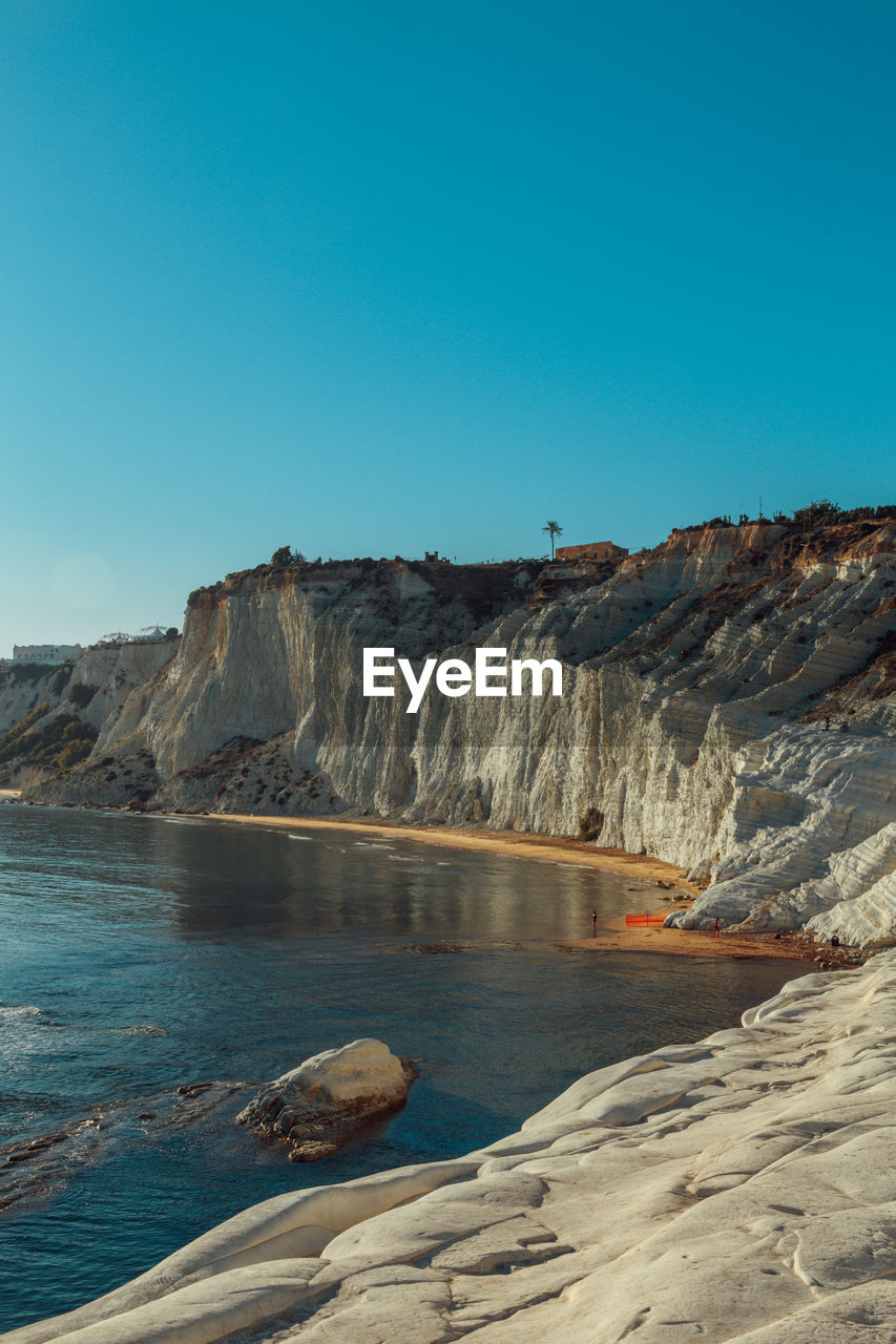 Scenic view of mountain against clear blue sky