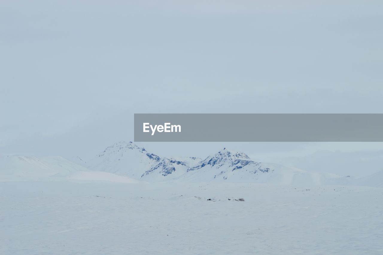 Scenic view of snow covered mountain against sky