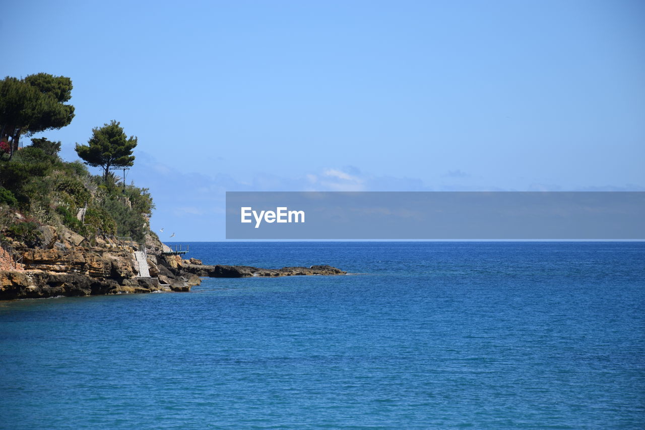 SCENIC VIEW OF SEA AGAINST BLUE SKY