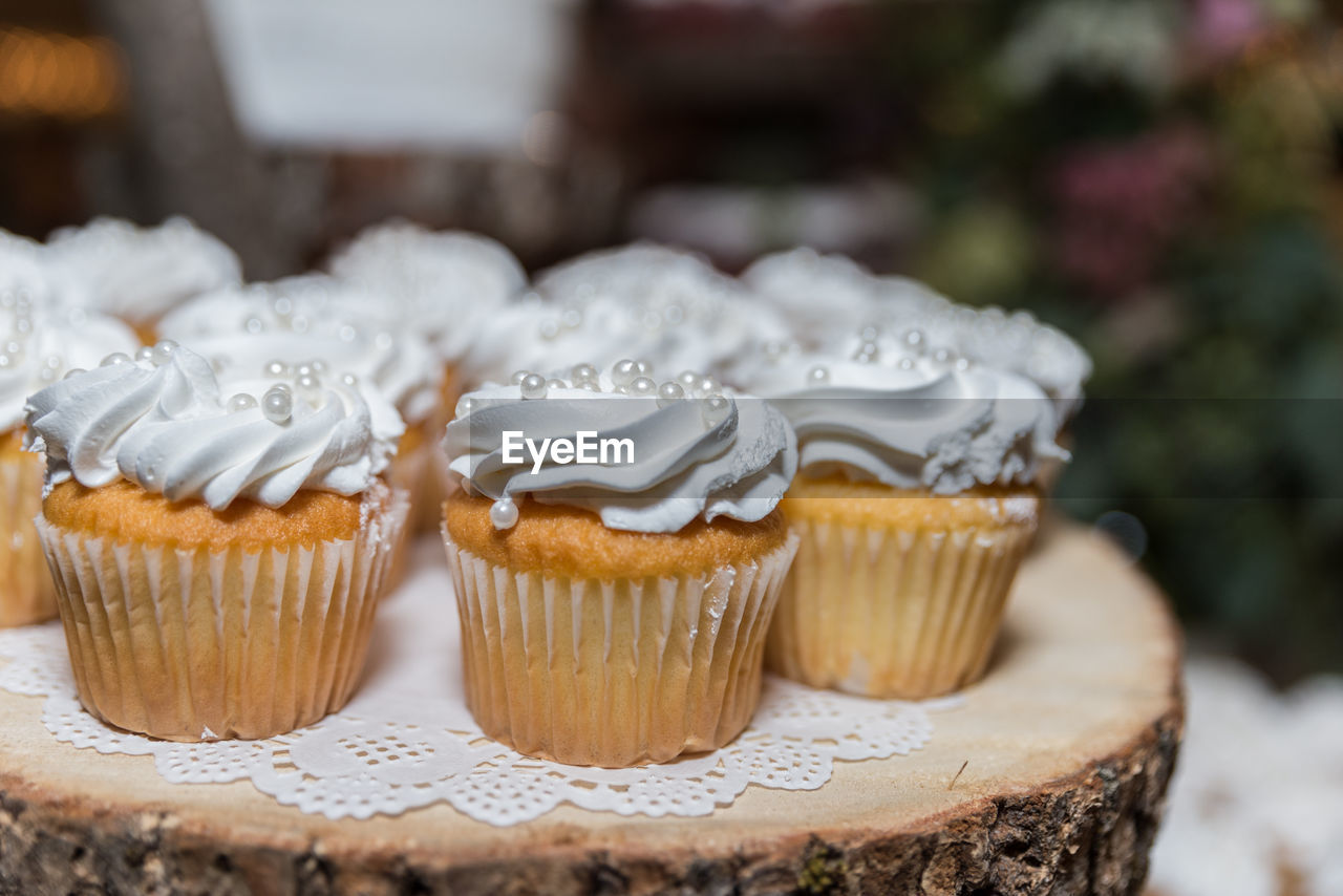 Close-up of cupcakes on wooden table