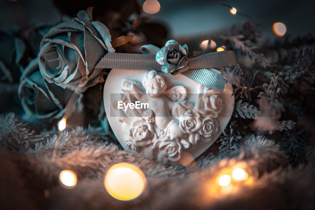 Close-up of christmas decorations with illuminated lights