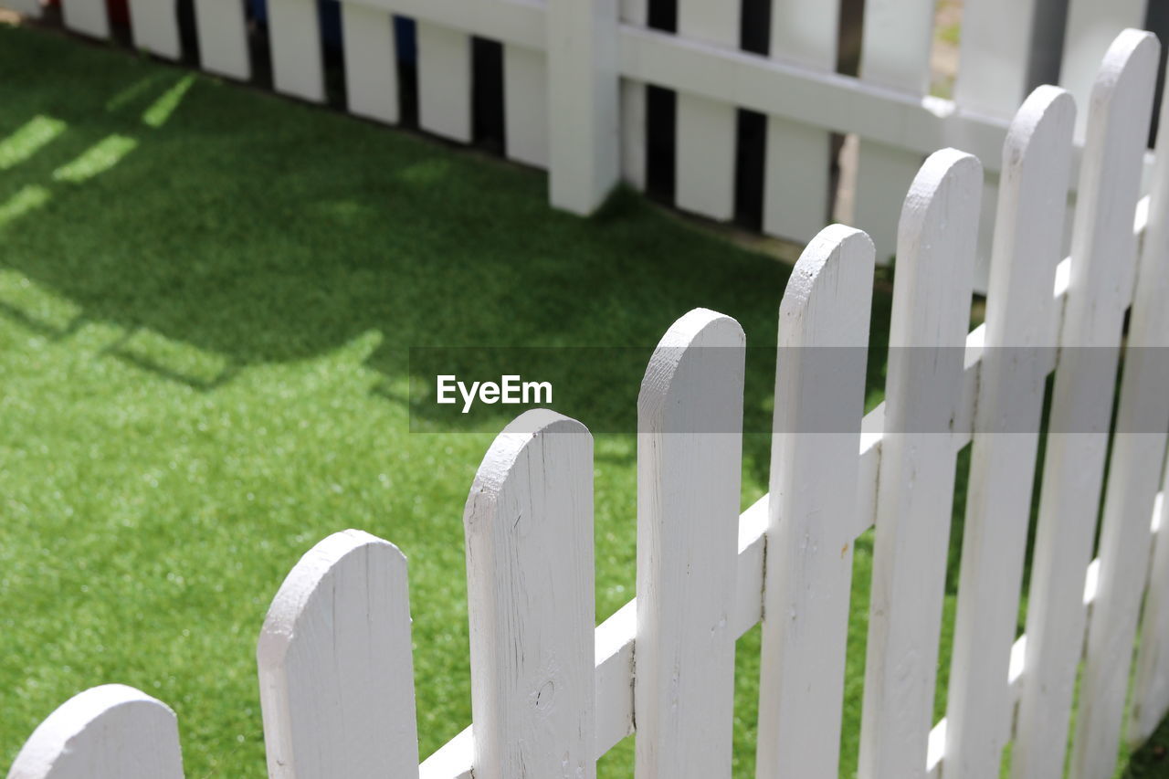 High angle view of picket fence in yard