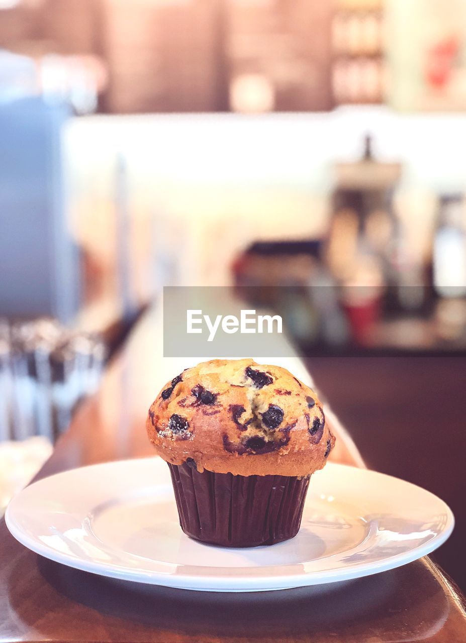 Close-up of cup cake in plate on table