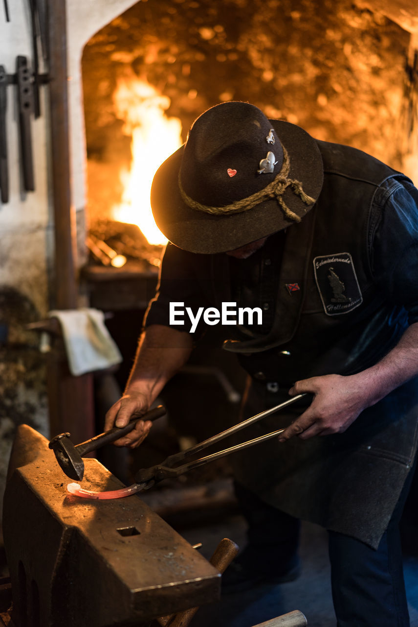 Man working on metal in workshop