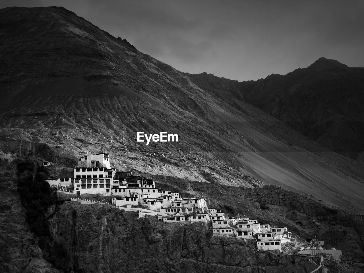 High angle view of townscape and mountains against sky