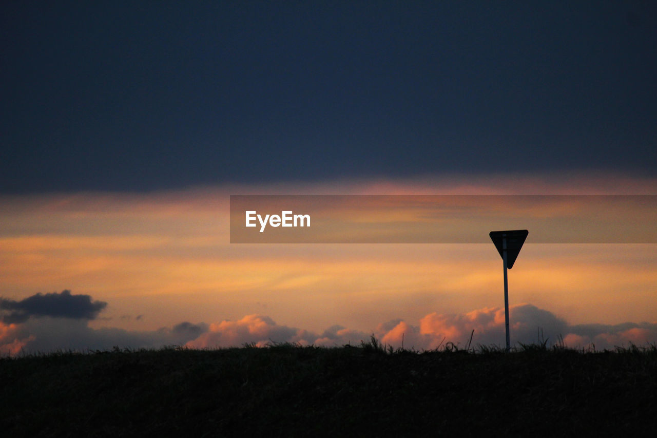 SILHOUETTE LANDSCAPE AGAINST SKY DURING SUNSET