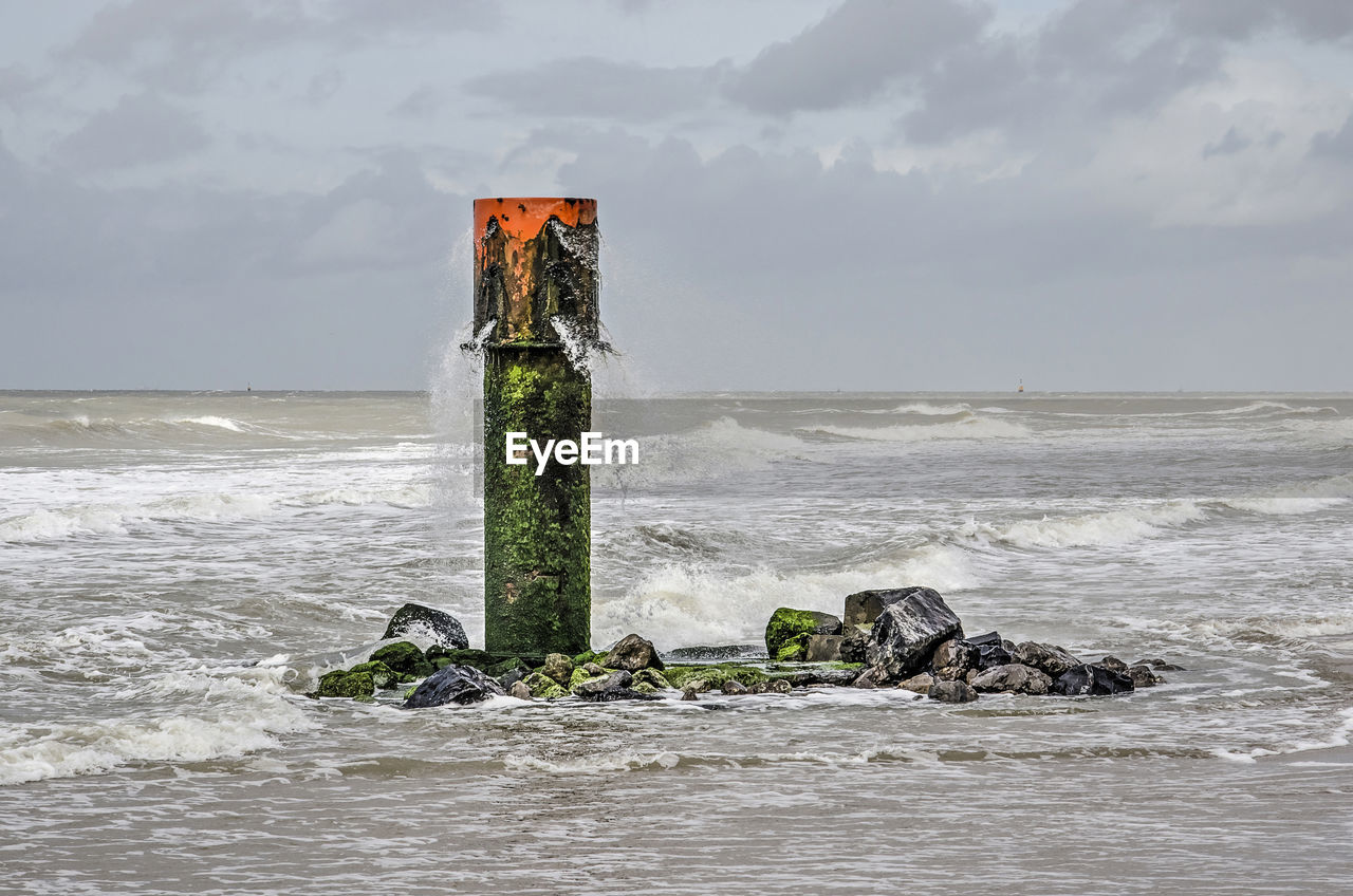 Pipe spouting water into the sea