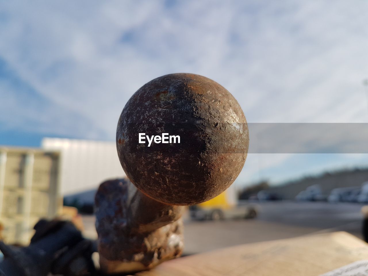 Close-up of a rusty, spherical metal object