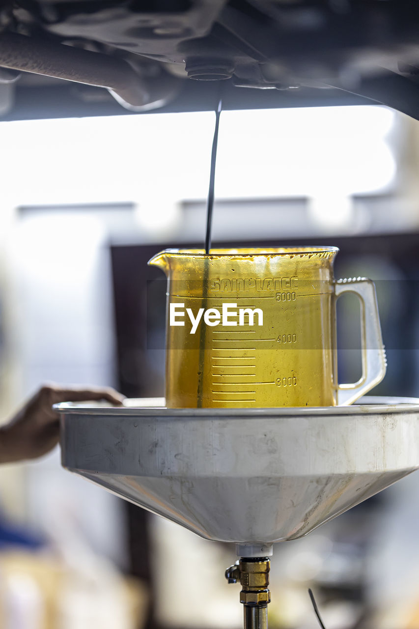 cropped hand of person holding coffee maker