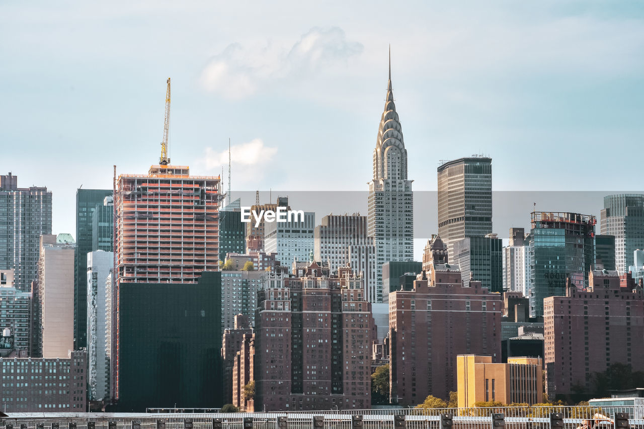 Office buildings and apartments on the skyline at sunset. manhattan, new york city, usa.