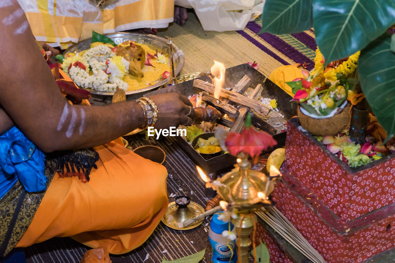 Side view of sadhu performing prayer