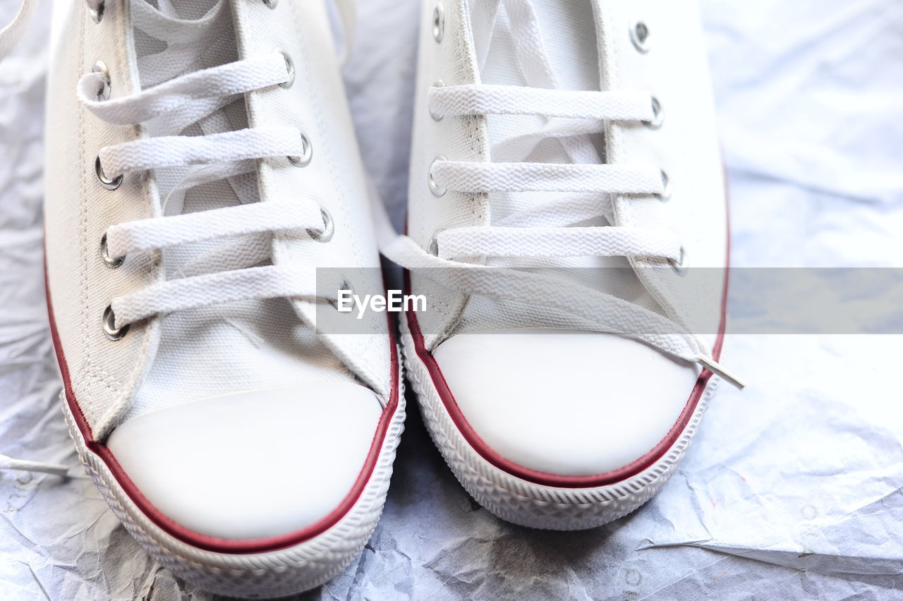 High angle view of shoes on paper