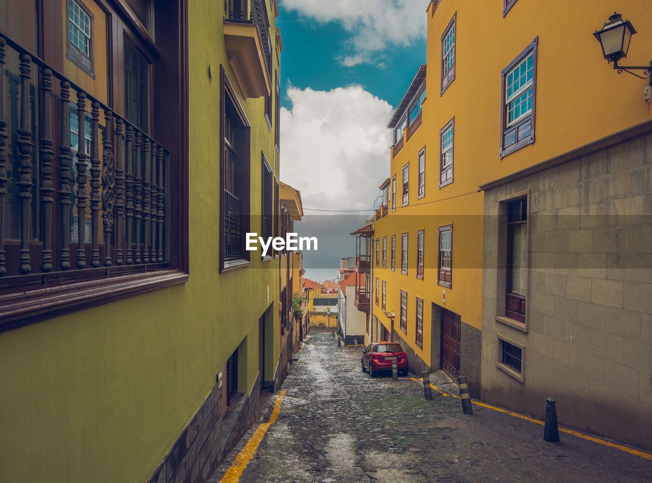 STREET AMIDST BUILDINGS IN CITY