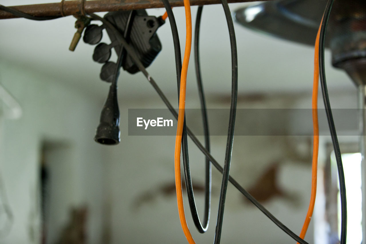 Low angle view of bicycle hanging on rope