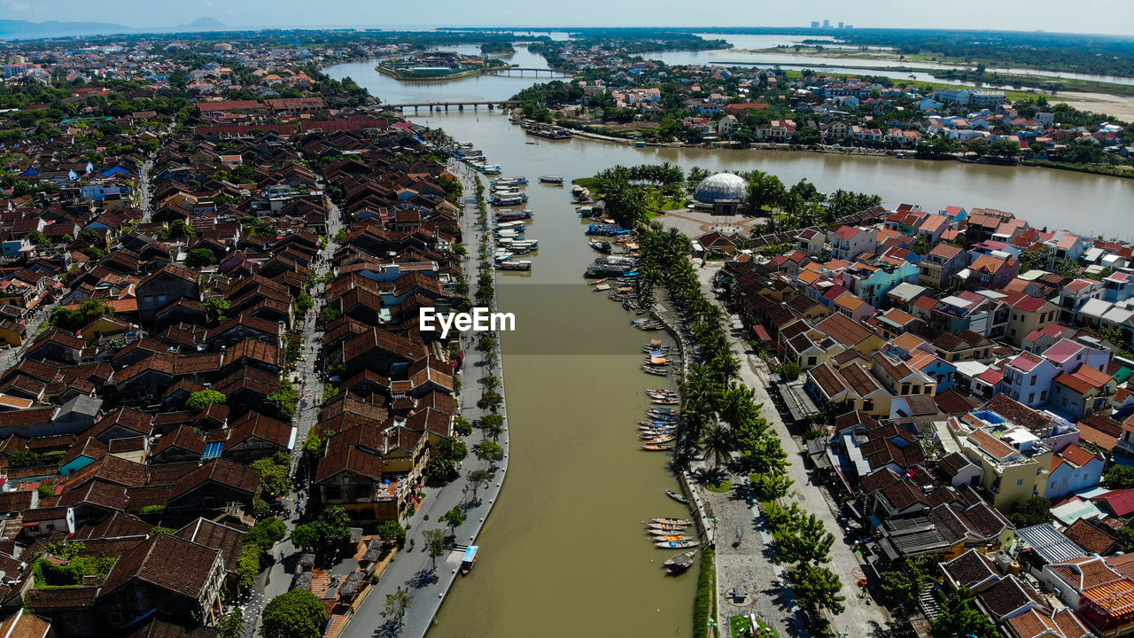 High angle view of river amidst buildings in city