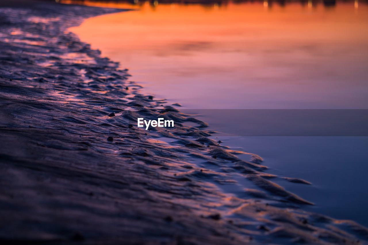 Scenic view of sea against sky at sunset