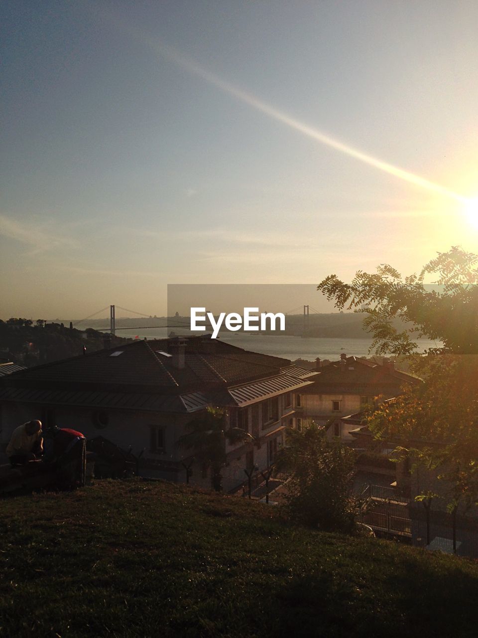 High angle view of houses against sky at sunset