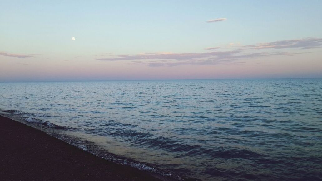 View of calm beach against the sky