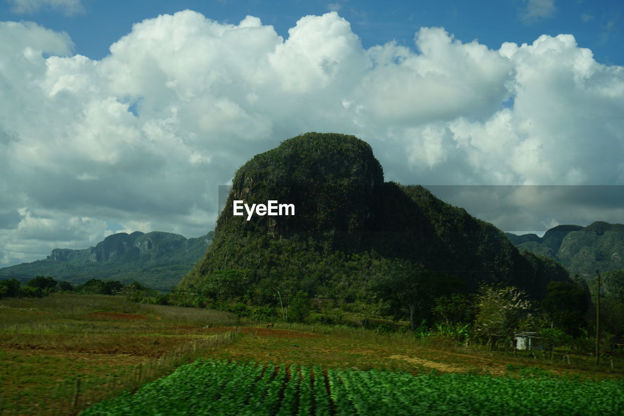 SCENIC VIEW OF LAND AND MOUNTAINS AGAINST SKY