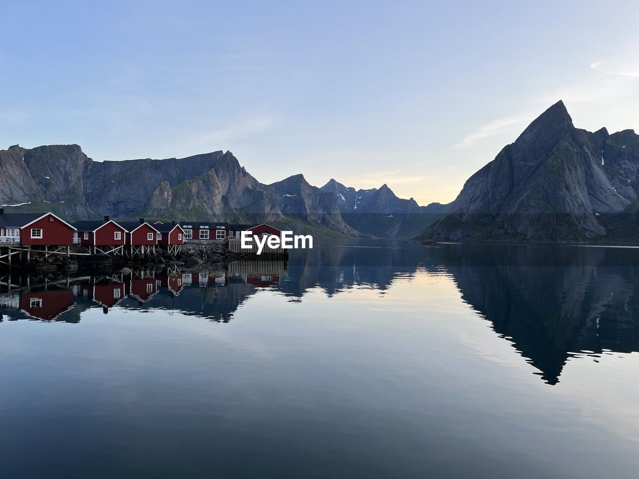 reflection, water, sky, nature, architecture, lake, cloud, mountain, morning, scenics - nature, beauty in nature, tranquility, built structure, landscape, no people, travel destinations, building, building exterior, tranquil scene, outdoors, environment, travel, winter, blue, dusk, snow, house