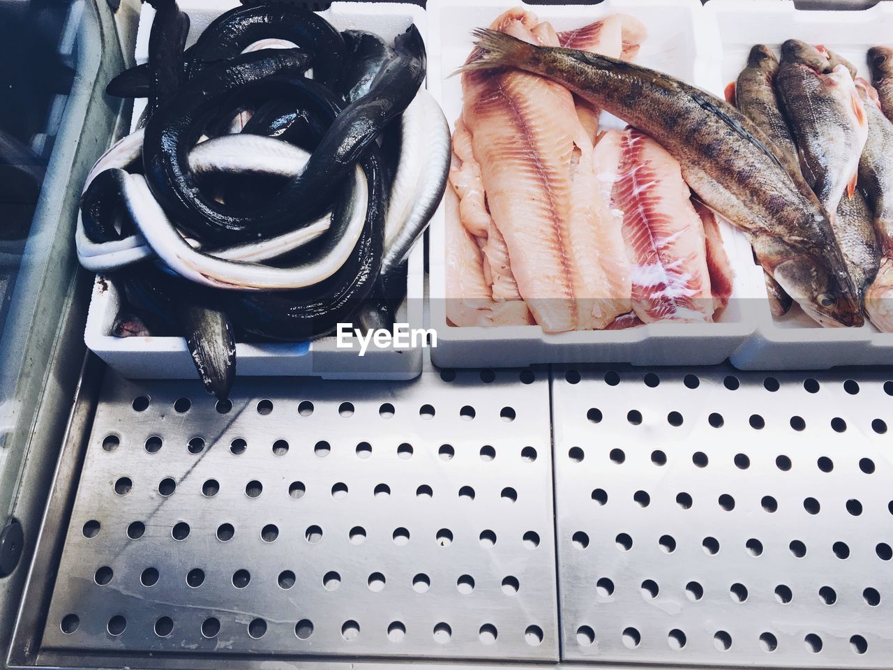 HIGH ANGLE VIEW OF FISH FOR SALE IN MARKET