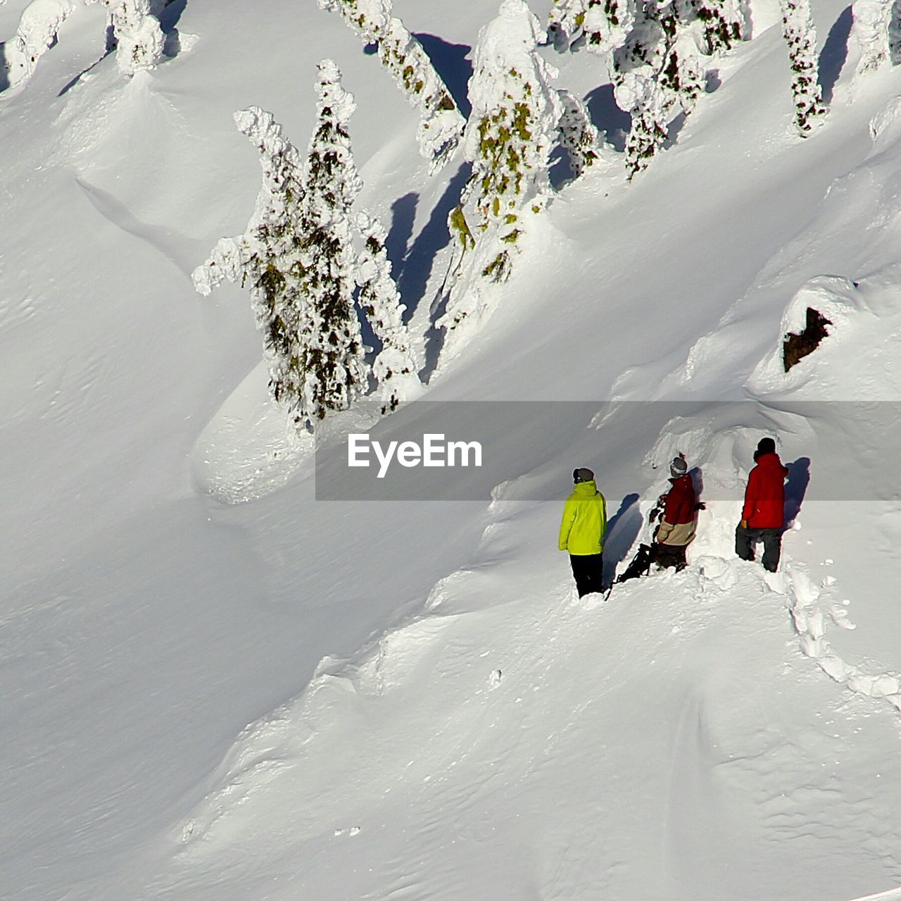 High angle view of people on snow covered field during winter