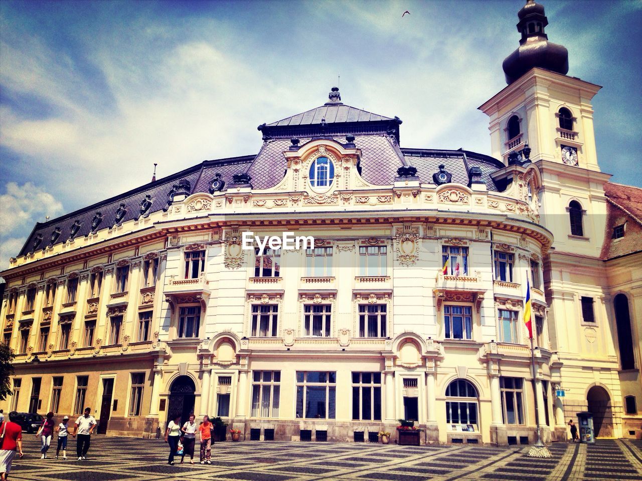 Low angle view of hotel against cloudy sky