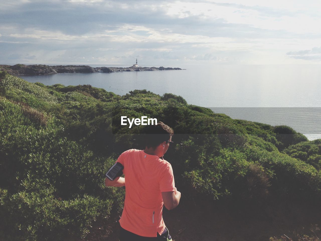 WOMAN LOOKING AT SEA