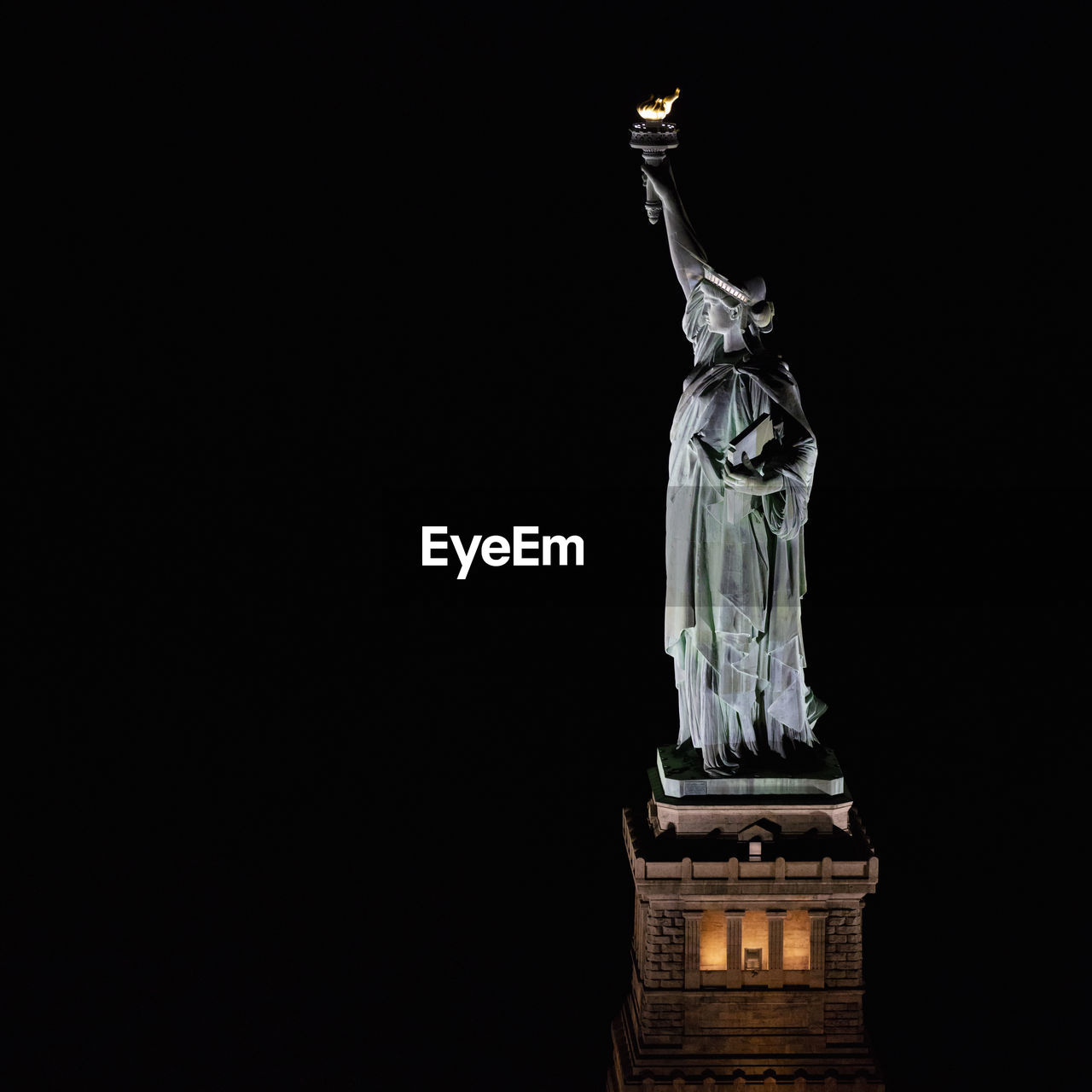 Usa, new york, new york city, statue of liberty illuminated at night