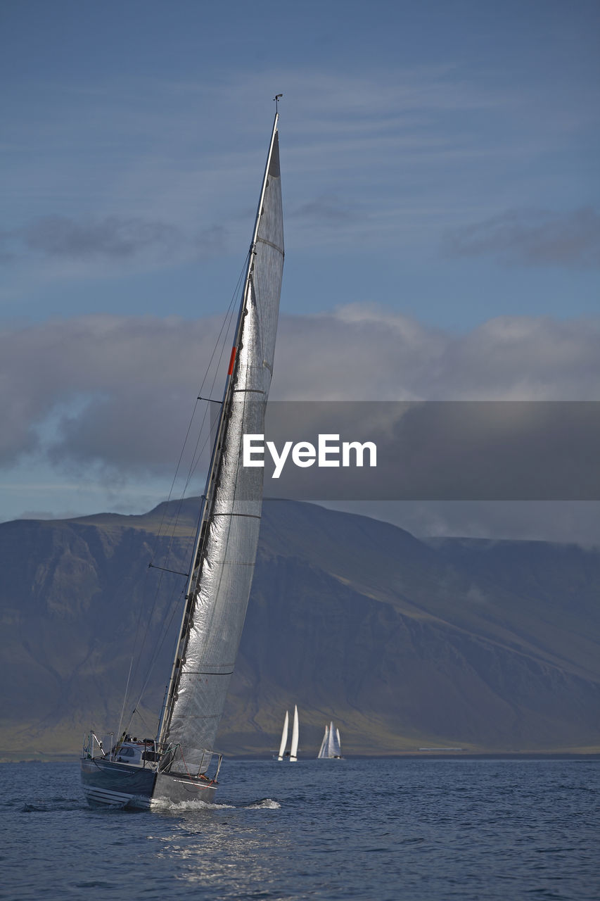 Sailboat tipping in wind close to reykjavik